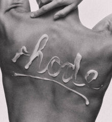 rhode written on model's back with bb