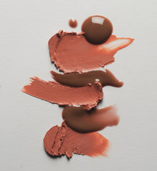 Smears of peach and brown makeup pigments