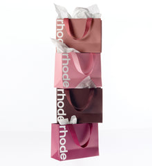 rhode gift bags in toast, ribbon, espresso, raspberry jelly colors